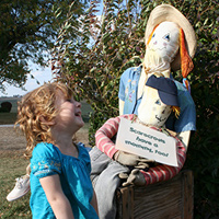 girl and scarecrow